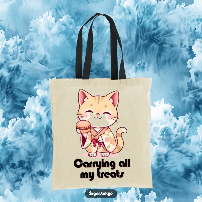 Funny tote bag showcasing a smiling cat in a floral kimono, offering a macaron, perfect for stylish and humorous everyday use.