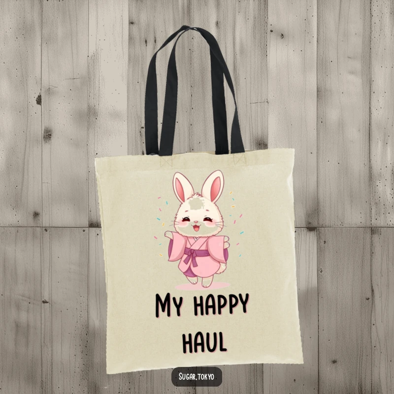 Funny tote bag showcasing a fluffy bunny in a pink kimono, joyfully twirling with sprinkles, ideal for stylish carrying.